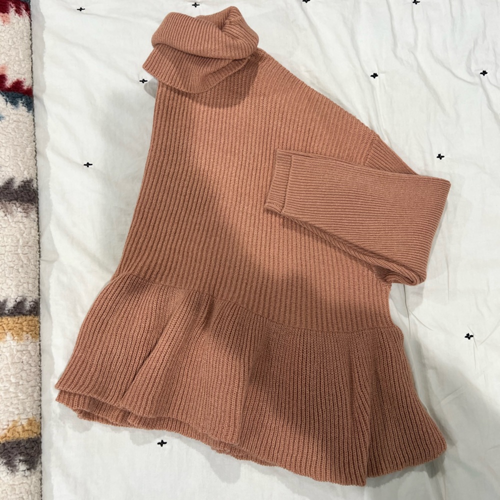 Pink peplum sweater